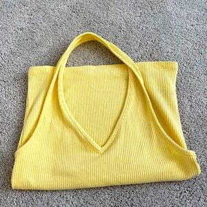 pastel yellow crop top over the neck